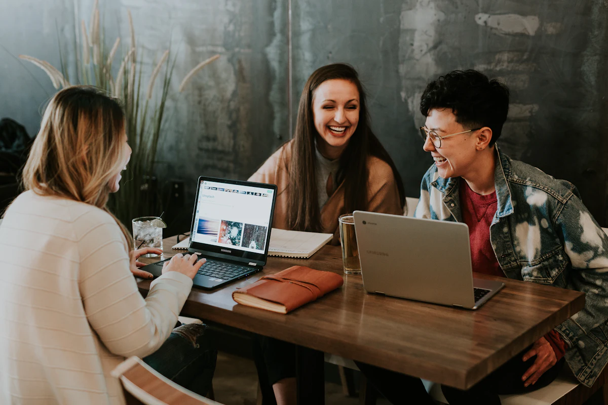 Colleagues laughing together at a table